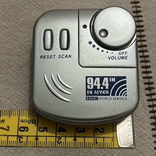 Pocket Radio with Headphones like new, silver color