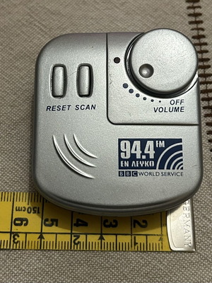 Pocket Radio with Headphones like new, silver color
