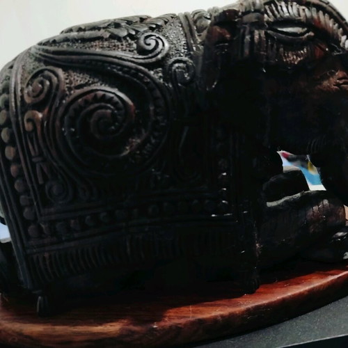 Wooden handmade elephant with carved details like new