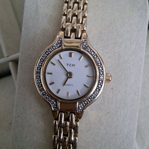 TCM women's watch used, gold-tone with minor scratch on glass