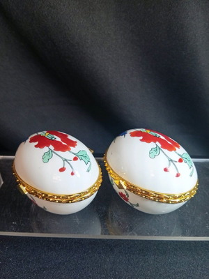 Set of two small porcelain egg-shaped jewelry boxes