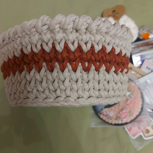 Knitted basket like new with gifts made of macrame cord