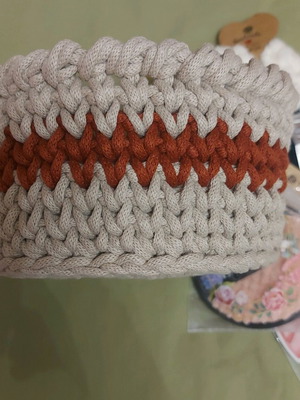 Knitted basket like new with gifts made of macrame cord
