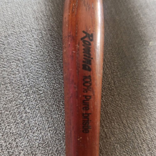 Round styling brush used, natural bristles