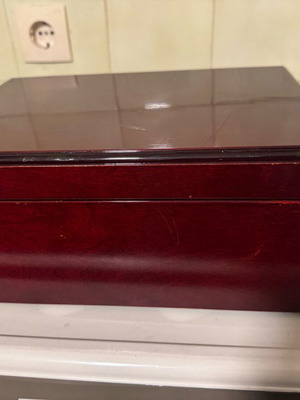 Wooden cigar humidifier used with cedar lining, cherry finish