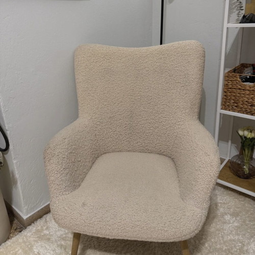 Armchair used, off-white fuzzy with steel legs