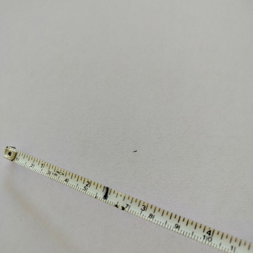 Measuring tape used in centimeters and inches, unknown origin