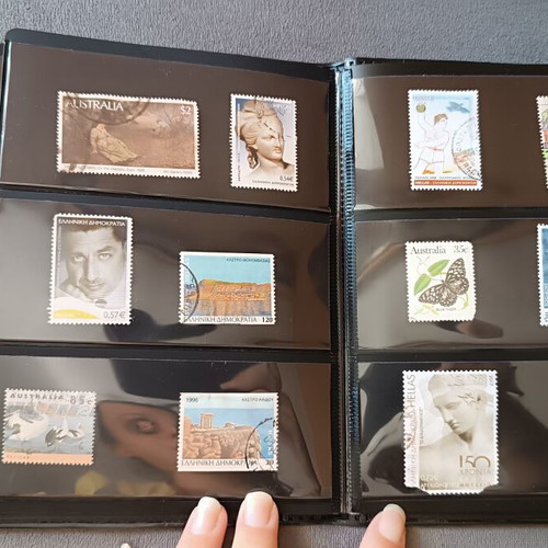 Stamp album with 120 stamps like new, Greece Australia Cyprus Germany America Canada