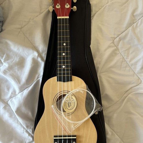 Ukulele like new with torn bag