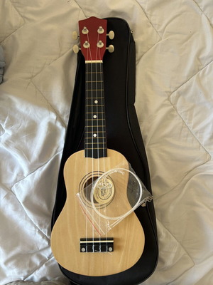 Ukulele like new with torn bag