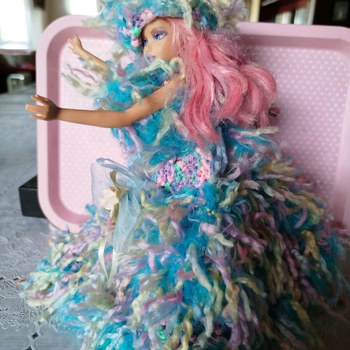Doll with handmade dress and hat used