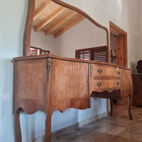 Classic wooden buffet with large curved mirror