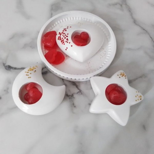 Set of three white tealight holders with round tray and cinnamon wax melts