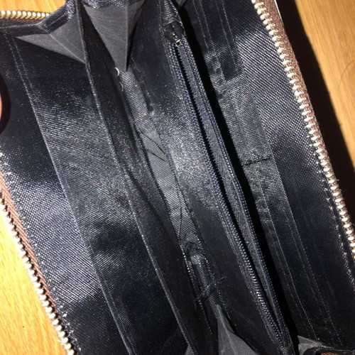 Wallet used with wear on inner zipper