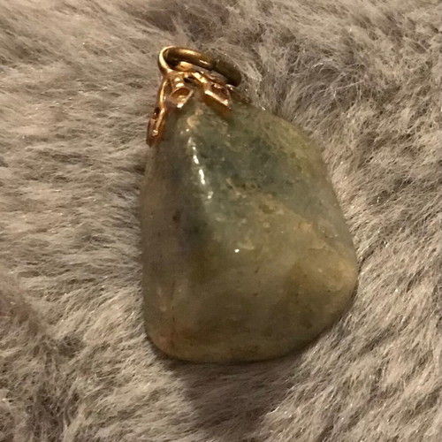 Quartz pendant with rutilated inclusions new, green and gold