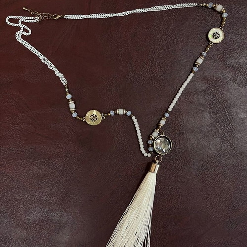 White necklace with gold details and tassel new