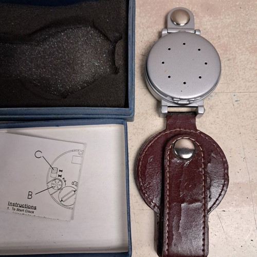 Travel alarm clock like new with leather cover