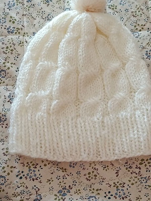 Children's knitted hat with pom pom, like new, white