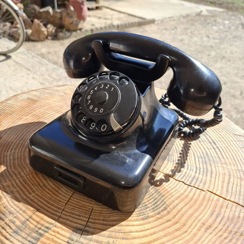 Collectible old-style telephone used, black, functional