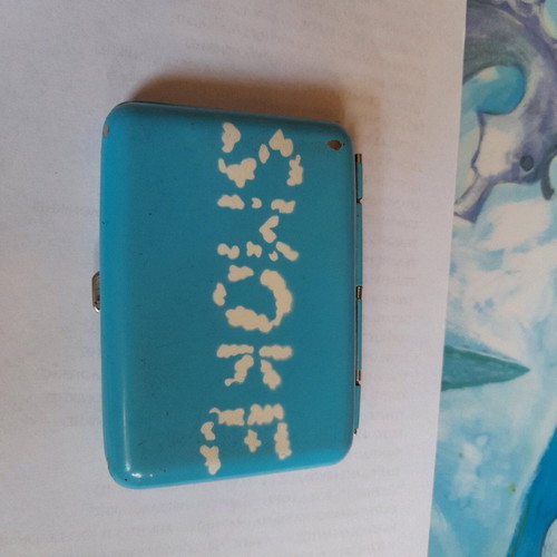 Tobacco case used, sky blue with white smoke clouds