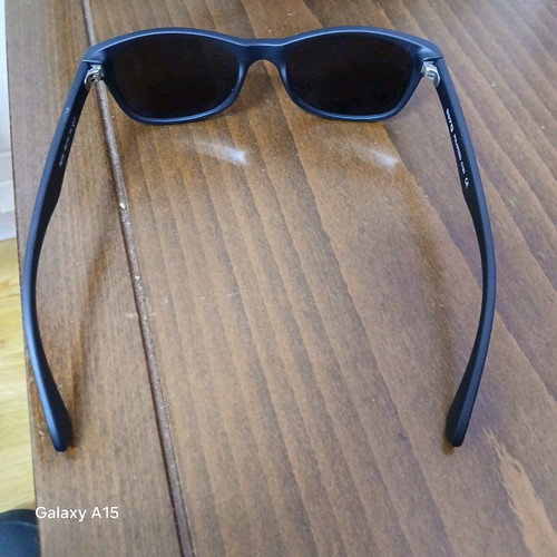 Swing sunglasses new with black plastic frame and men's lenses