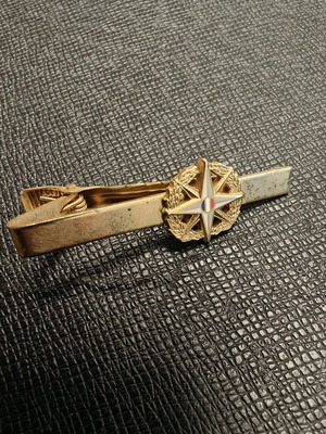 Collectible tie clip used, gold color with French security emblem