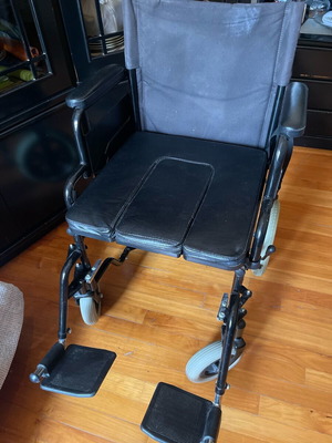 Wheelchair used with operator brakes and indoor small wheels