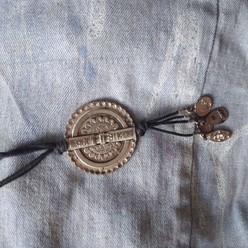 Necklace with steel pendant like new on leather straps