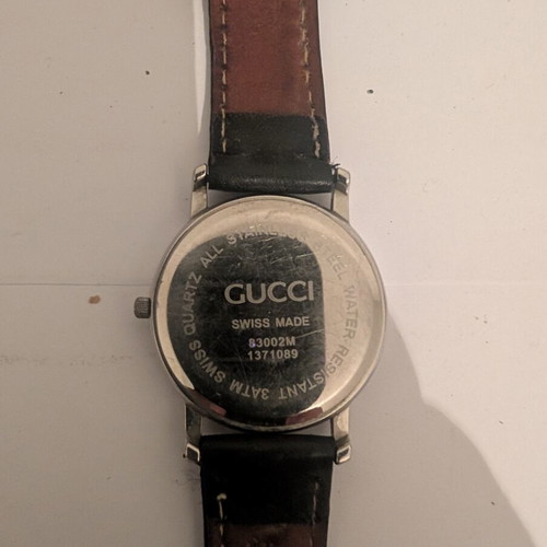 Gucci vintage women's wristwatch, stainless steel, black leather strap