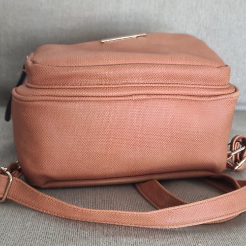 Back pack tan used with internal and external pockets