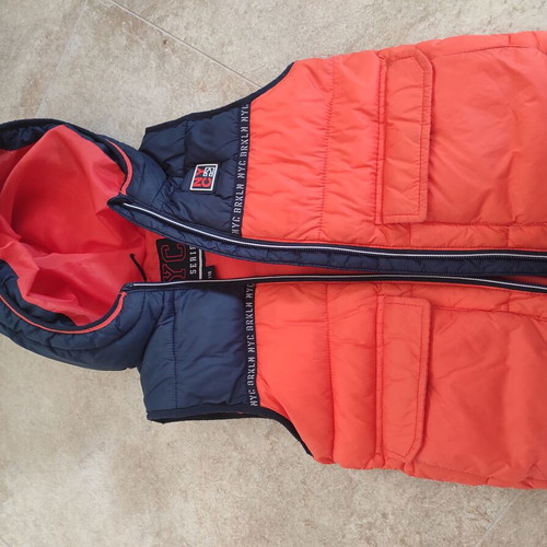 Sleeveless jacket for boy 5 years like new, orange and blue