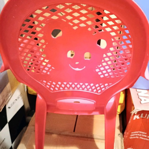 Children's chair used, red plastic with arms and Minnie design