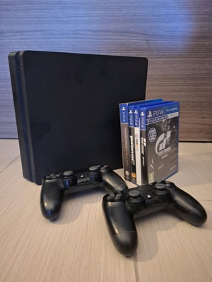 Sony PlayStation 4 Slim used with 2 controllers and 4 games