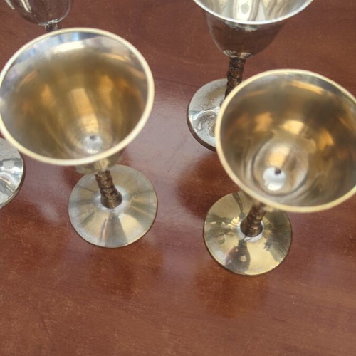 Silver-plated liqueur glasses used with some wear