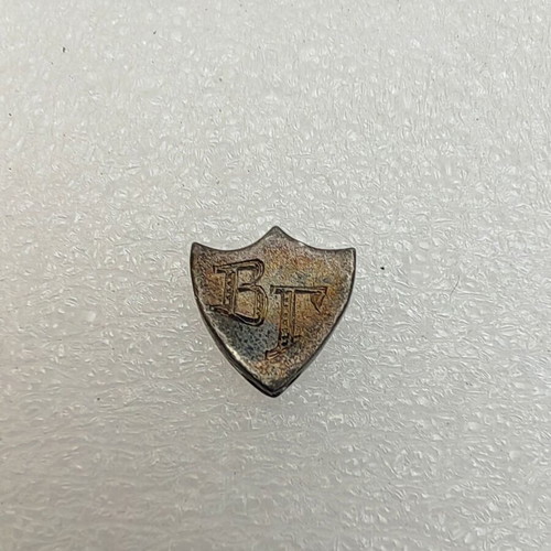 Silver 950 badge used with initials VG