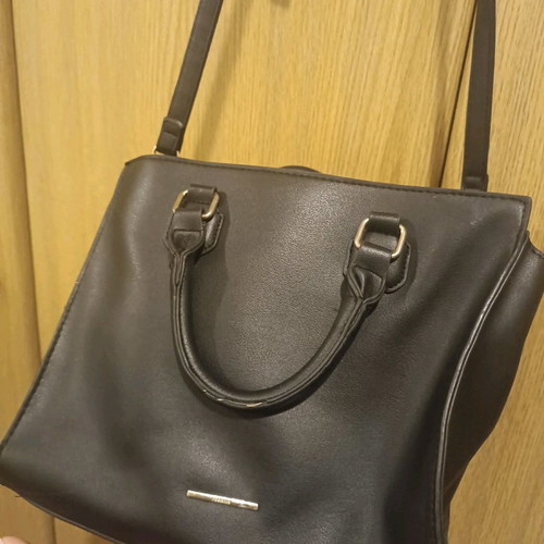 Handbag used with crossbody strap and spacious interior