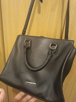 Handbag used with crossbody strap and spacious interior