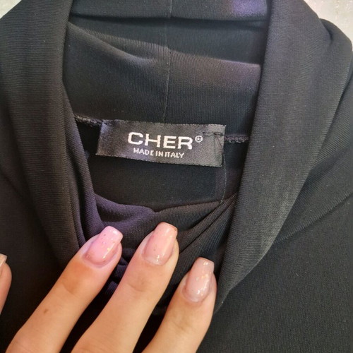 Turtleneck blouse with feathers like new