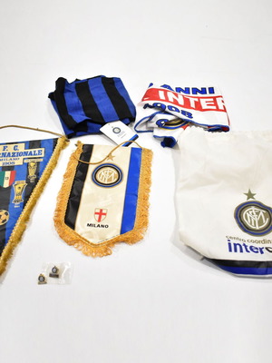 Inter collection with scarves, pennants, cufflinks, magazines and backpack