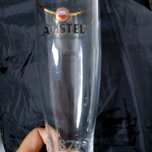 Amstel beer glass with a golden rim