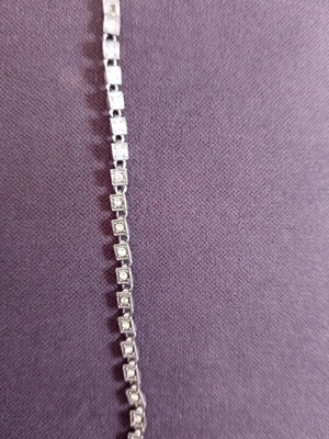 Bracelet used, missing one stone, white color