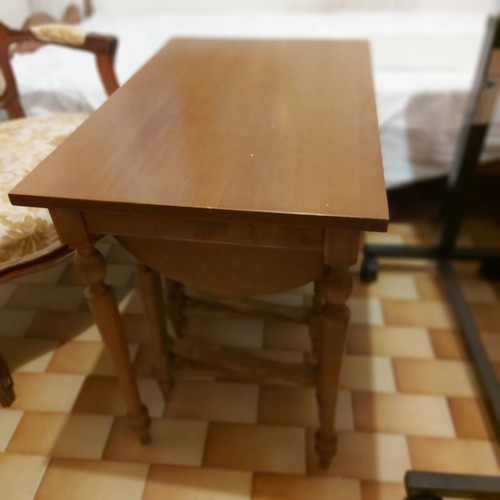 Rectangular table with 4 used round nesting tables
