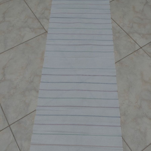 Traditional cotton fabric on loom, new, white with colorful stripes