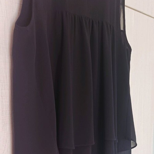 Sleeveless women's blouse black like new with ruffles and sheer detail