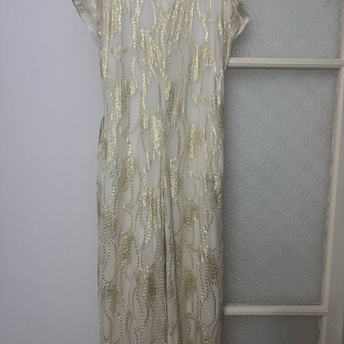 Overall jumpsuit with a belt.