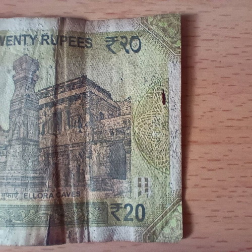 Indian 20 Rupees banknote used with tear