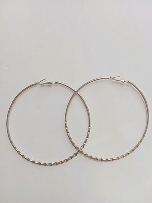 Large hoop earrings used