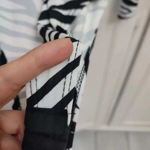 Long-sleeve zebra print bodysuit with V-neck and knot, like new