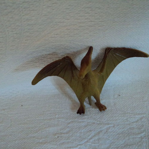 Small action figures used, approx. 8cm, including Power Rangers and Archaeopteryx