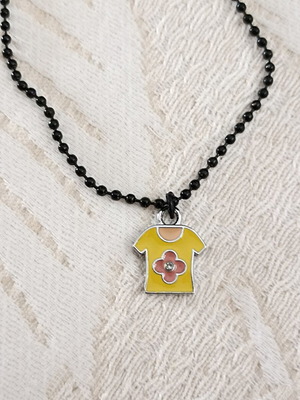 Pendant with yellow steel charm on black chain, new